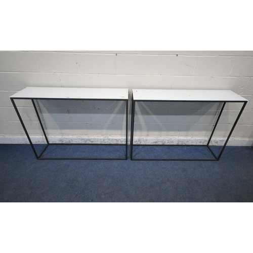 1245 - A PAIR OF RV ASTLEY AMADEO RECTANGULAR SIDE TABLES, with milky glass surface, raised on a metal fram... 