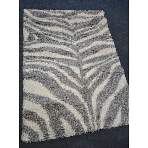 1247 - A MAISONS DU MONDE RECTANGULAR RUG, 200cm x 142cm, along with a smaller rug (condition report: overa... 