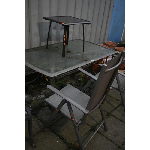 1003 - A METAL AND GLASS GARDEN TABLE, length 151cm x depth 90cm x height 72cm, a pair of folding armchairs... 