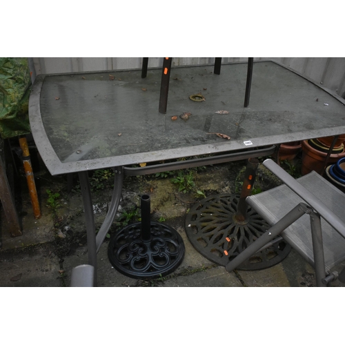 1003 - A METAL AND GLASS GARDEN TABLE, length 151cm x depth 90cm x height 72cm, a pair of folding armchairs... 