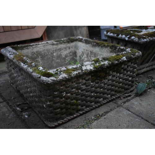 1010 - A WEATHERED COMPOSITE SQUARE PLANTER, with a basket weave design, 55cm squared x height 23cm, along ... 