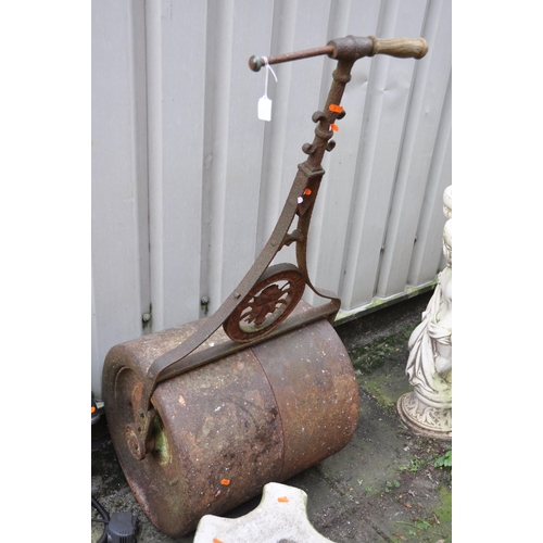 1016 - A VINTAGE CAST IRON GARDEN ROLLER, along with a Victorian style water pump with later electric fitti... 