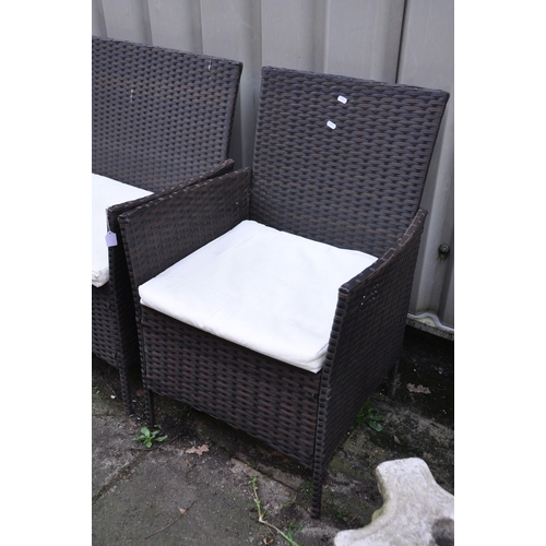 1017 - AN UNBRANDED FAUX RATTAN FOUR PIECE GARDEN SET, comprising a two seater sofa, length 104cm, pair of ... 