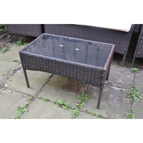 1017 - AN UNBRANDED FAUX RATTAN FOUR PIECE GARDEN SET, comprising a two seater sofa, length 104cm, pair of ... 