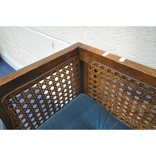 1326 - A LATE 20TH CENTURY WINDOW SEAT, with cane back and sides, blue upholstered seat, raised on square t... 