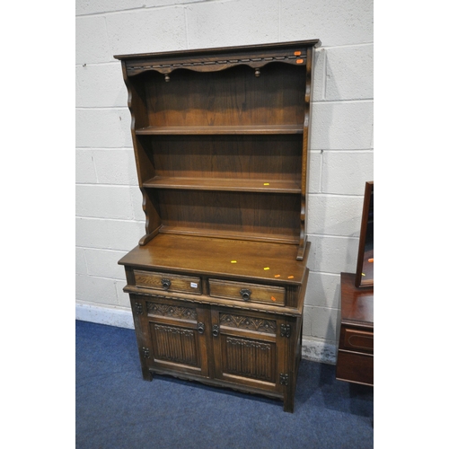 1330 - AN OLD CHARM OAK DRESSER, the two tier plate atop a base with two drawers, and double linenfold cupb... 