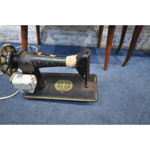 1331 - A PAIR OF EBONISED SPINNING CHAIRS, a sewing box, and a sewing machine (condition report: sewing mac... 