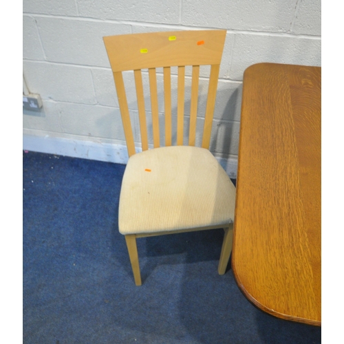 1338 - A 20TH CENTURY OAK DROP LEAF TABLE, with two drawers, raised on castors, open width 149cm x depth 10... 