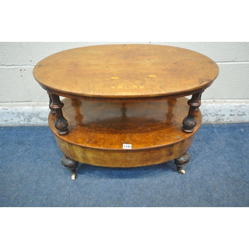 1340 - A VICTORIAN WALNUT TWO TIER OCCASIONAL TABLE, with turned supports, a single drawer, raised on turne... 