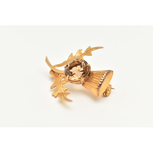 1 - A 9CT GOLD THISTLE BROOCH, set with a circular cut smoky quartz in a five claw setting, fitted with ... 