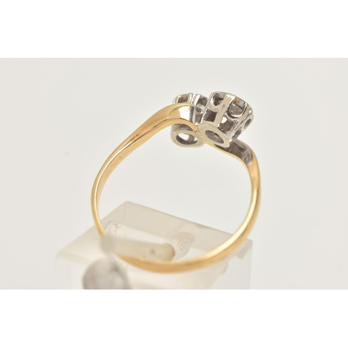 12 - A TWO STONE DIAMOND RING, a toi et moi design ring, two round brilliant cut diamonds in a white meta... 