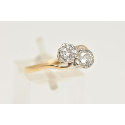 12 - A TWO STONE DIAMOND RING, a toi et moi design ring, two round brilliant cut diamonds in a white meta... 