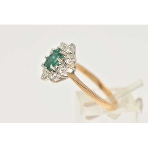 17 - AN 18CT GOLD EMERALD AND DIAMOND RING, designed and an oval cut emerald, approximate emerald carat w... 