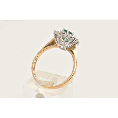 17 - AN 18CT GOLD EMERALD AND DIAMOND RING, designed and an oval cut emerald, approximate emerald carat w... 