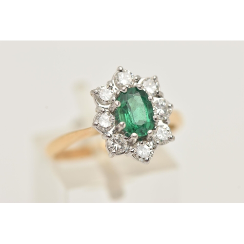 17 - AN 18CT GOLD EMERALD AND DIAMOND RING, designed and an oval cut emerald, approximate emerald carat w... 