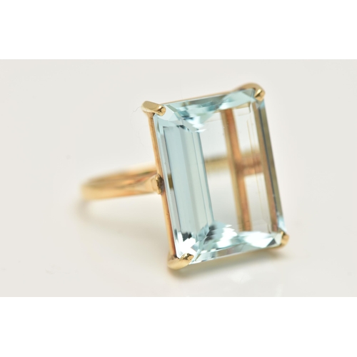 18 - A LARGE AQUAMARINE DRESS RING, an emerald cut aquamarine, approximate total weight 37ct, approximate... 