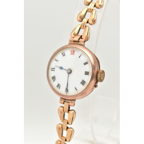 33 - A 9CT GOLD LADIES WRISTWATCH, hand wound movement, round white dial, Roman numerals, rose gold case,... 