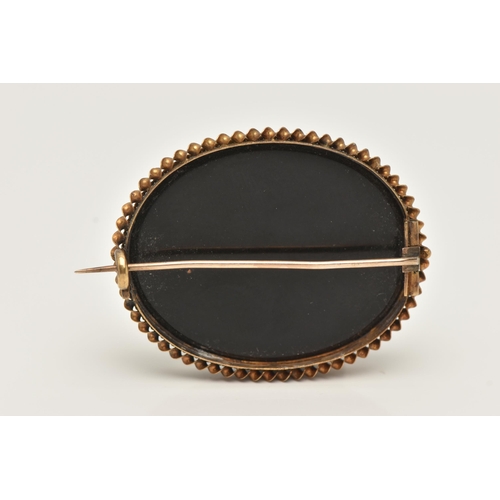 43 - A PIETRA DURA BROOCH, of an oval form depicting flowers, collet set with a rope twist surround, fitt... 