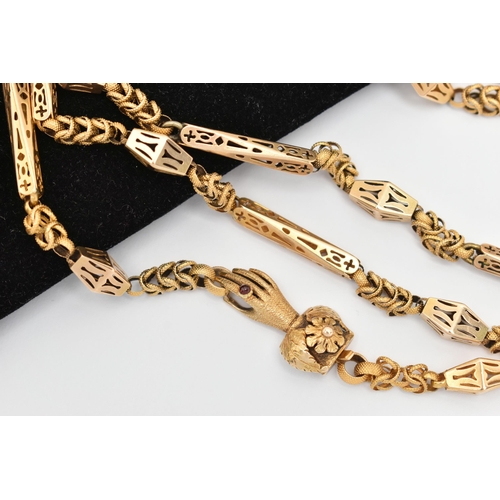 48 - A VICTORIAN YELLOW METAL LONG GUARD CHAIN WITH HAND CLASP, fancy link chain made up of open work lin... 