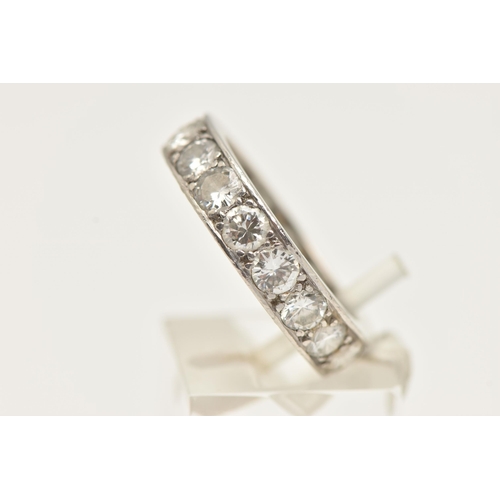 5 - A WHITE METAL DIAMOND FULL ETERNITY RING, set with approximately seventeen round brilliant cut diamo... 