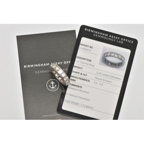 5 - A WHITE METAL DIAMOND FULL ETERNITY RING, set with approximately seventeen round brilliant cut diamo... 