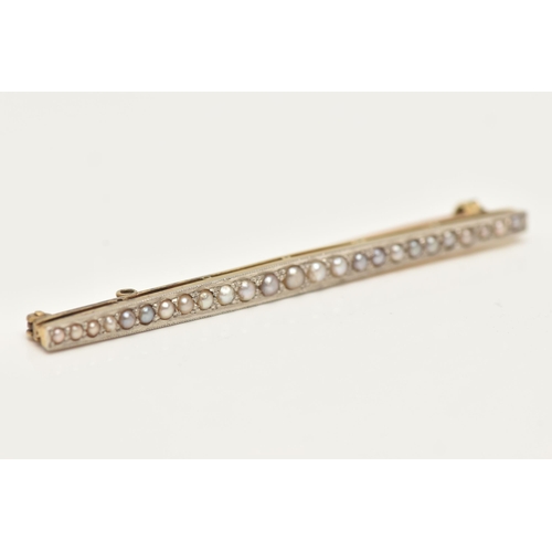 56 - AN EARLY 20TH CENTURY YELLOW METAL SPLIT PEARL BAR BROOCH, set with a row of graduating split pearls... 