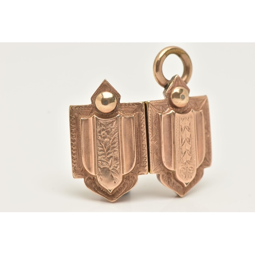 58 - A LATE 19TH CENTURY/EARLY 20TH CENTURY ROSE GOLD PLATED LOCKET, of a shield shape decorated with an ... 