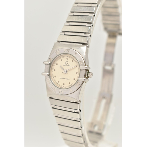 102 - A LADIES OMEGA AND LONGINES WRISTWATCH, a quartz movement, round champagne tone dial signed 'Omega' ... 