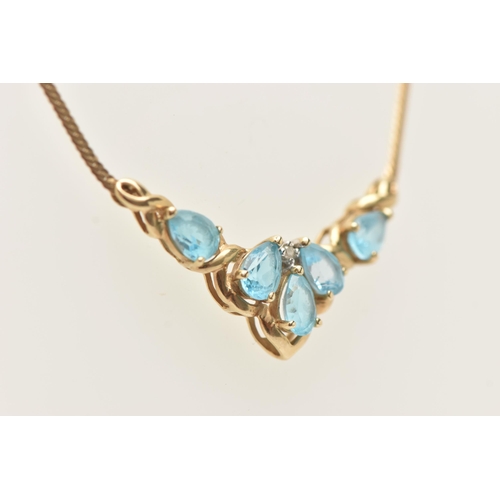 91 - A 9CT GOLD TOPAZ AND DIAMOND NECKLACE, the V shape pendant set with five pear cut blue topaz and a s... 