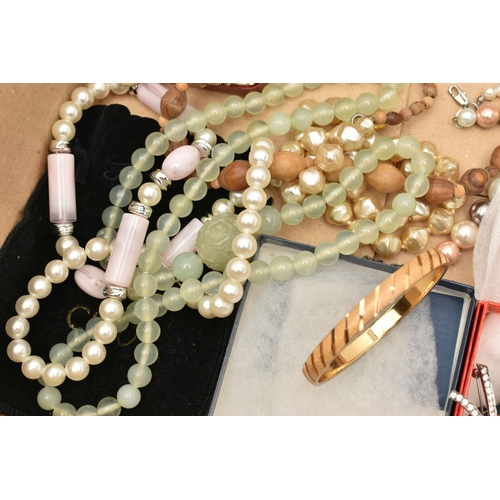 141 - A BOX OF ASSORTED COSTUME JEWELLERY, to include a selection of beaded necklaces, chain necklaces, a ... 