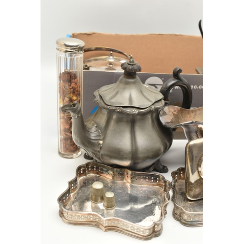 143 - A BOX OF MAINLY PLATED WARE, to include a teapot, gravy jug, small trays, thimbles, sugar tongs etc