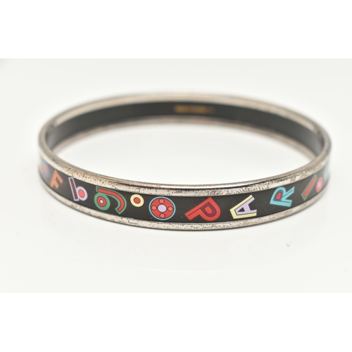 181 - A 'HERMES' BANGLE, designed as a solid silver plated bangle with enamel alphabet and number detail, ... 