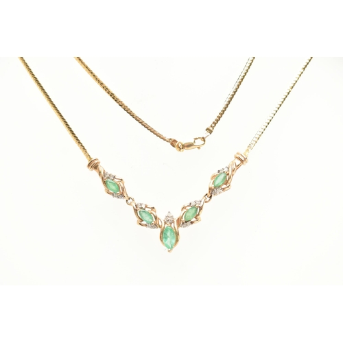 183 - A YELLOW METAL GEM SET NECKLACE, a V shape necklace comprised of five marquise cut emeralds and nine... 