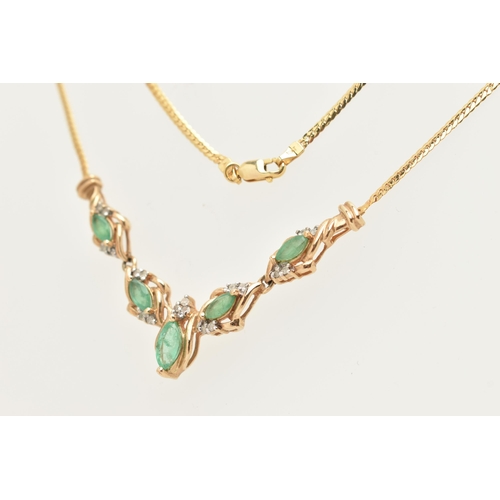 183 - A YELLOW METAL GEM SET NECKLACE, a V shape necklace comprised of five marquise cut emeralds and nine... 