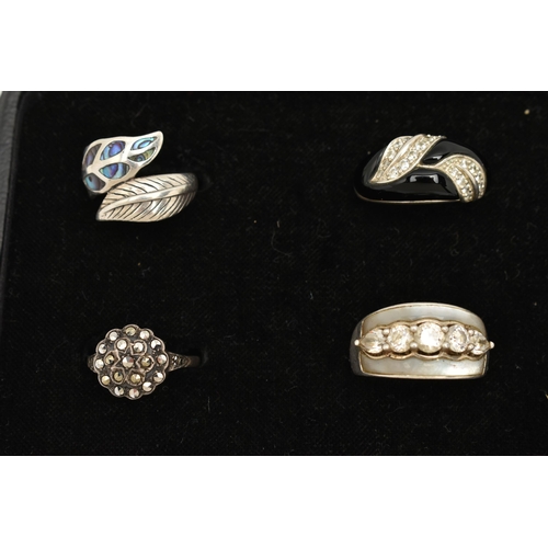 186 - TWELVE WHITE METAL RINGS, twelve white metal dress rings, some set with cubic zirconia, each stamped... 