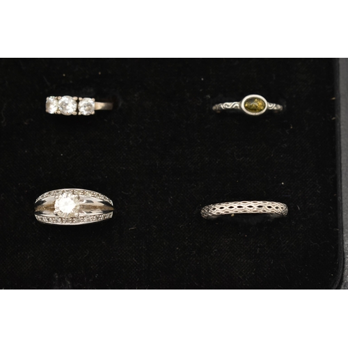 186 - TWELVE WHITE METAL RINGS, twelve white metal dress rings, some set with cubic zirconia, each stamped... 