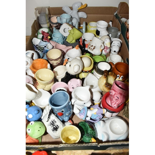 320 - THREE BOXES CONTAINING A COLLECTION OF EGG CUPS, to include two egg platters, approximately two hund... 