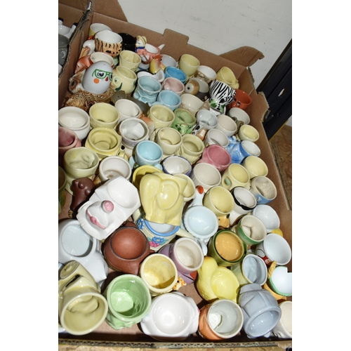 320 - THREE BOXES CONTAINING A COLLECTION OF EGG CUPS, to include two egg platters, approximately two hund... 