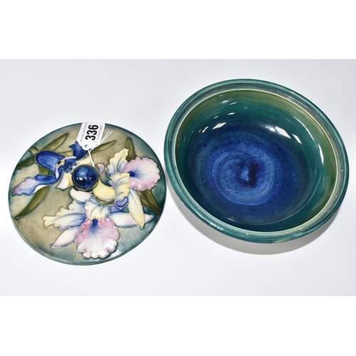 336 - A MOORCROFT POTTERY 'ORCHID' PATTERN COVERED BOWL, tube lined with blue and purple orchids on a grad... 