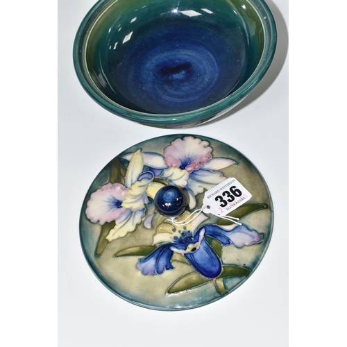 336 - A MOORCROFT POTTERY 'ORCHID' PATTERN COVERED BOWL, tube lined with blue and purple orchids on a grad... 