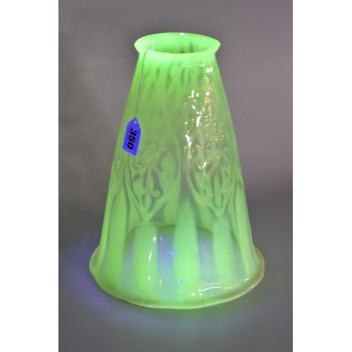 350 - A VASELINE GLASS LIGHT SHADE, the uranium glass light shade of tapering bell form, with slightly wav... 