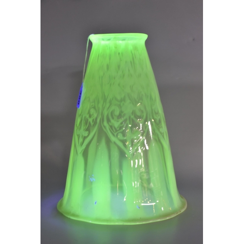 350 - A VASELINE GLASS LIGHT SHADE, the uranium glass light shade of tapering bell form, with slightly wav... 