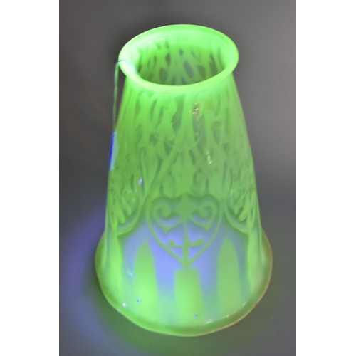 350 - A VASELINE GLASS LIGHT SHADE, the uranium glass light shade of tapering bell form, with slightly wav... 