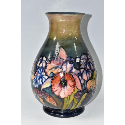 351 - A LARGE MOORCROFT POTTERY ORCHID PATTERN VASE, the baluster vase tube lined in the Orchid pattern on... 