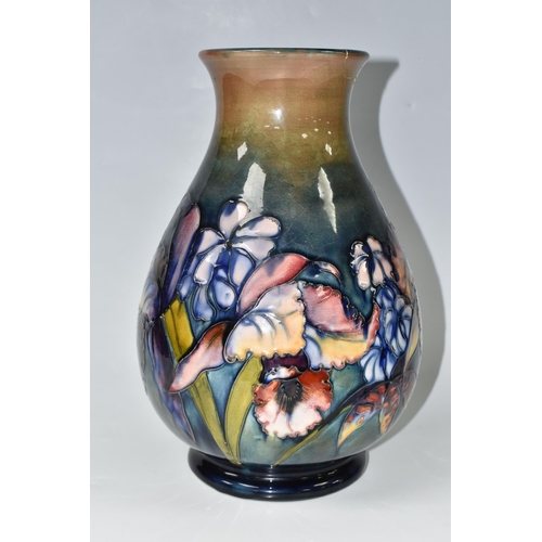 351 - A LARGE MOORCROFT POTTERY ORCHID PATTERN VASE, the baluster vase tube lined in the Orchid pattern on... 