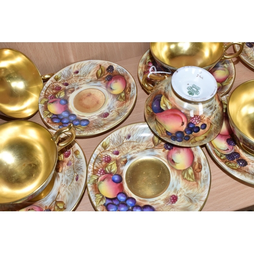 357 - SEVEN AYNSLEY ORCHARD GOLD TEACUPS AND SAUCERS, each teacup with gilt interior, rim, handle and foot... 