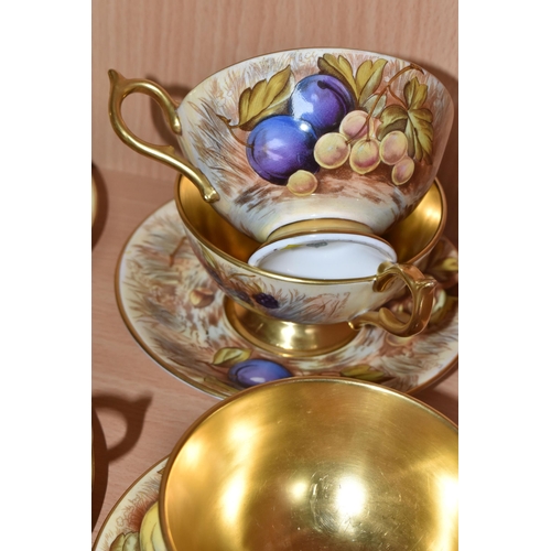 357 - SEVEN AYNSLEY ORCHARD GOLD TEACUPS AND SAUCERS, each teacup with gilt interior, rim, handle and foot... 