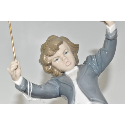 358 - A LLADRO 'LITTLE MAESTRO' FIGURE, depicting a young conductor, model no 6349, sculptor Juan Huerta, ... 