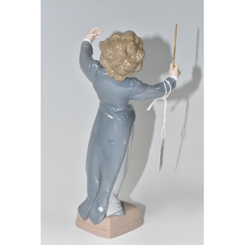 358 - A LLADRO 'LITTLE MAESTRO' FIGURE, depicting a young conductor, model no 6349, sculptor Juan Huerta, ... 