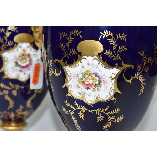 362 - A PAIR OF COALPORT COVERED VASES, of urn form with twin gilt ram's head handles, on a square pedesta... 